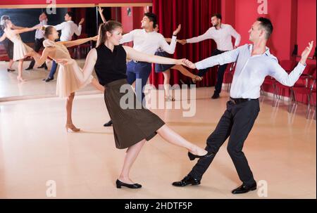 People practicing vigorous lindy hop movements Stock Photo