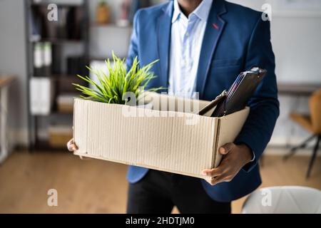 Fired Employee With Box. Unemployed Businessman Moving Stock Photo