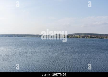 Water surface with ripples and sunrays reflections Stock Photo