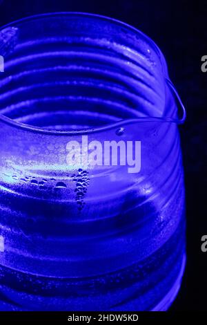Glass electric kettle with blue LED lighting close-up. Stock Photo