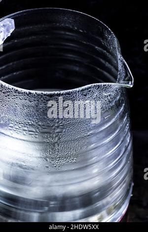 Glass electric kettle with blue LED lighting close-up. Stock Photo