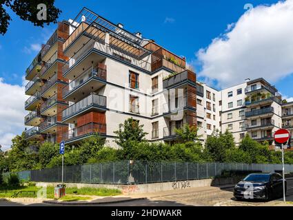 Warsaw, Poland - July 11, 2021: Modern prestigious residential plaza building at 23A Madalinskiego and Grazyny street in Mokotow district of Warsaw Stock Photo
