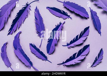 Abstract violet very peri background with paper feathers Stock Photo