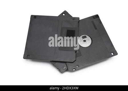 Close-up of three dot five inch high density floppy disks stacked on top of each other on white background concept for obsolete data storage Stock Photo