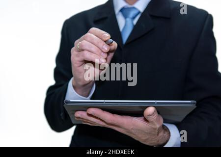 Unrecognizable businessman with a tablet using a digital pen, white background Stock Photo