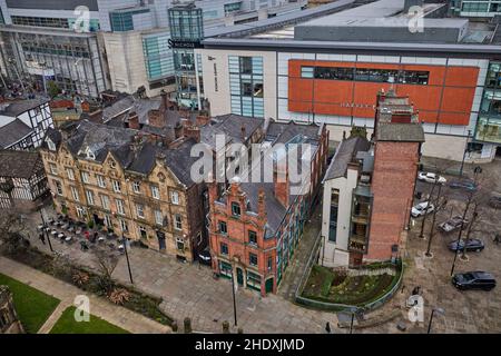 Manchester city centre  Cateaton Street, Crown & Anchor pub, Proper Tea and Mynshulls House offices with Mahatma Gandhi Statue outside Stock Photo