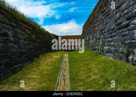 the dry moat that circles fort charlotte Stock Photo