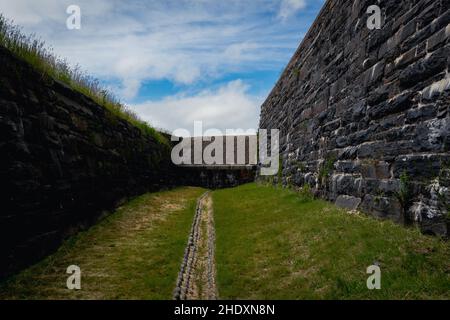 the dry moat that circles fort charlotte Stock Photo