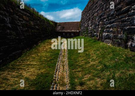 the dry moat that circles fort charlotte Stock Photo