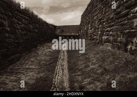 the dry moat that circles fort charlotte Stock Photo