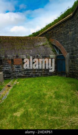 the dry moat that circles fort charlotte Stock Photo