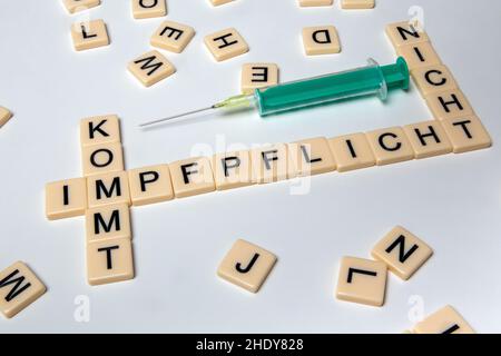 Symbolic image on the issue of compulsory vaccination in Germany: Letter cubes show the words vaccination compulsory, is coming and is not coming (Imp Stock Photo