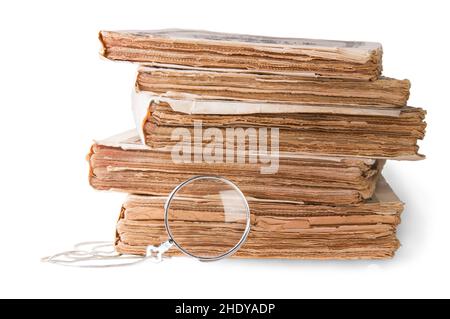 magnifying glass, stacking books Stock Photo