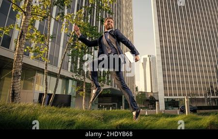running entrepreneur. agile business. professional network administrator hold computer. Stock Photo