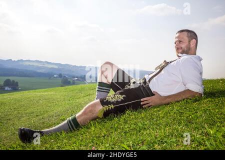 man, lying, bavarian, lederhosen, guy, men, lying down, bavarians, lederhosens Stock Photo