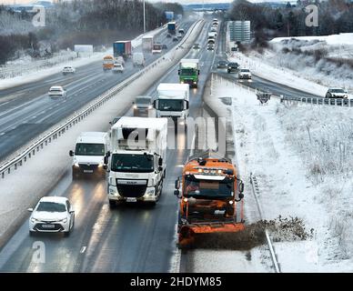 West Lothian, UK. 07th Jan, 2022. A gritter clears the M8 motorway in West Lothian after the first serious snow fall of the winter hit the central belt. (c) Credit: Dave Johnston/Alamy Live News Stock Photo