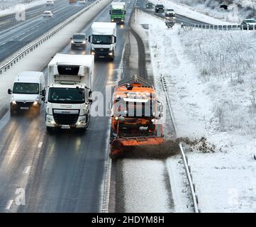 West Lothian, UK. 07th Jan, 2022. A gritter clears the M8 motorway in West Lothian after the first serious snow fall of the winter hit the central belt. (c) Credit: Dave Johnston/Alamy Live News Stock Photo