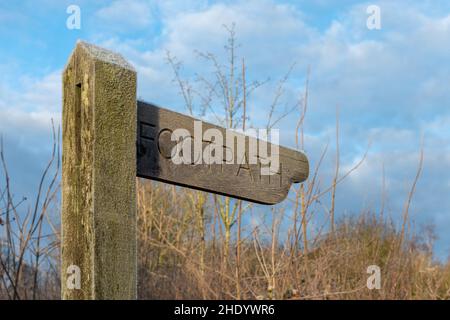 Wooden footpath sign with frost on a winter morning in January, England, UK