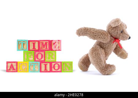 Time for action business concept with wood blocks and teddy bear Stock Photo