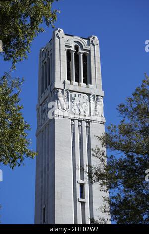 North Carolina State University Memorial Bell tower is a 115 foot tall free-standing bell tower that sits on the main campus of NCSU. Stock Photo