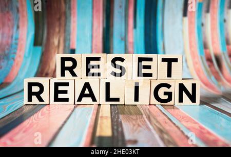 reset, realign concept - abstract words written on wooden blocks Stock Photo