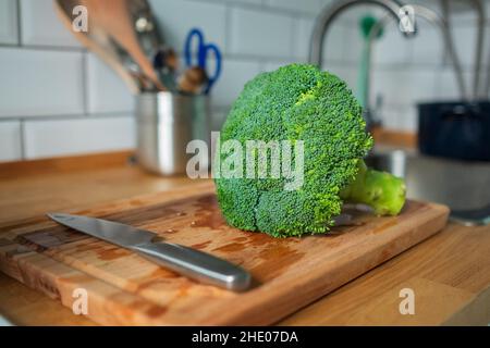 Fresh broccoli isolated on a kitchen table Stock Photo