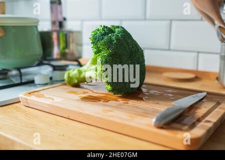Fresh broccoli isolated on a kitchen table Stock Photo