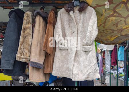 Vintage Sheepskin Winter Coats at Flea Market Stall Stock Photo