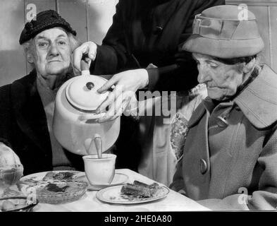 Waitress pouring tea for elderly ladies in the Black Country, West Midlands, Uk Stock Photo
