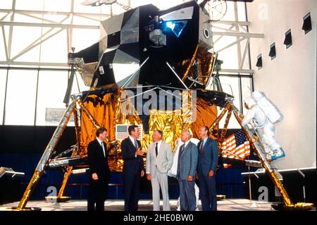 From left to right: United States Vice President Dan Quayle, US President George H.W. Bush, Neil Armstrong, Buzz Aldrin, and Michael Collins converse as they pose for a photo in front of Lunar Module 2, which is on display at the National Air and Space Museum on Washington, DC on July 20, 1989. The occasion marks the 20th anniversary of the Apollo 11 Moon landing. Credit: Robert Trippett/Pool via CNP Stock Photo
