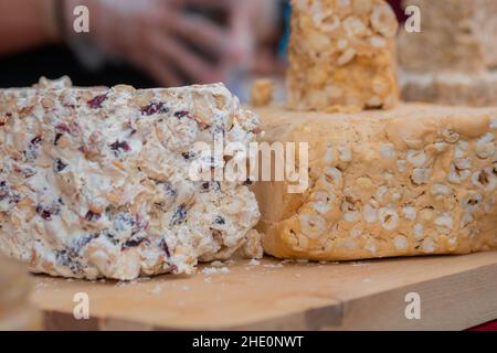 Sherbet with nuts and dried fruits on counter at summer local food market Stock Photo