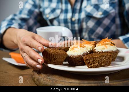 Muffins with carrot, walnuts and cinnamon. Delicious homemade appetizer Stock Photo