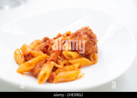 italian ragu pasta on plate close up on white background Stock Photo