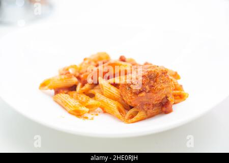 italian ragu pasta on plate close up on white background Stock Photo