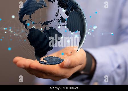 Male's hands pointing to an illustration of global network concept Stock Photo