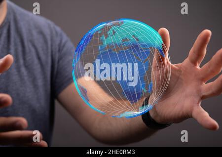 Male's hands holding an illustration of global network concept Stock Photo