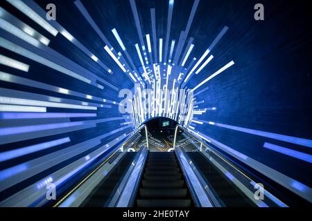 Futuristic tunnel escalator with lights and graphic lines Stock Photo