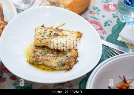 fried king prawns and cod fillet on plate closeup Stock Photo