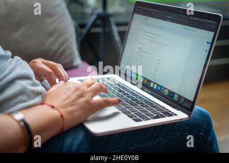 Woman works from home on laptop computer, London,UK Stock Photo