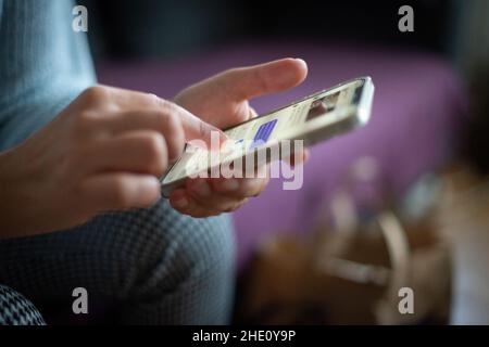 woman chatting online, sending text messages on social media on smart phone- close-up, selective focus Stock Photo