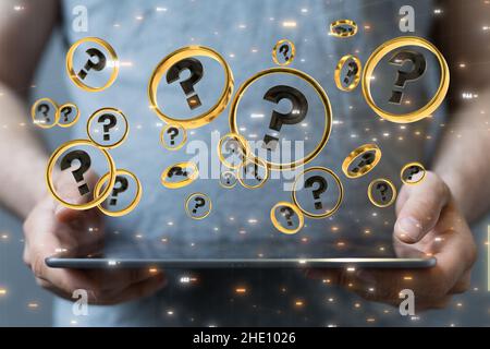 Male's hand holding an illustration of question marks in circles Stock Photo