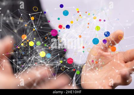 Male's hands holding an illustration of videoconference group of people talking on social network Stock Photo