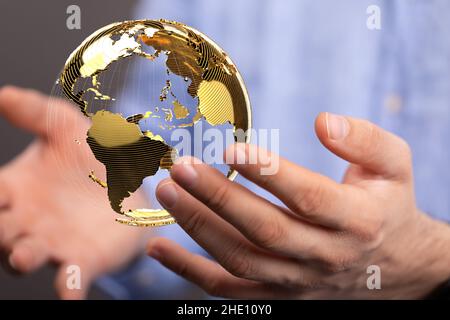 Male's hands holding an illustration of global network concept Stock Photo