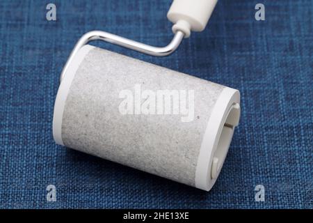 close up of used sticky roller cleaning, housework and housekeeping concept Stock Photo
