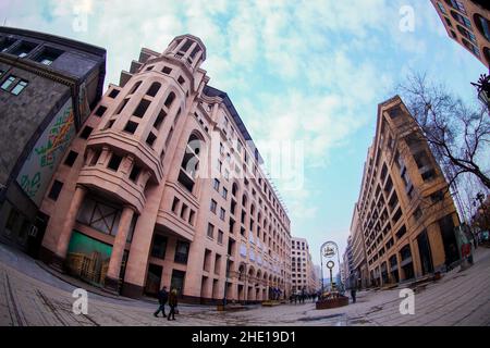 A low angle eyefish shot of the buildings in northern avenue against a blue sky. Yerevan, Armenia Stock Photo