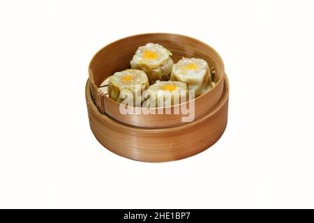 various types of dim sum in a bamboo container on a white background Stock Photo