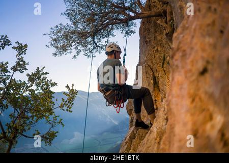 Man is climbing, hiking in the mountains. Stock Photo