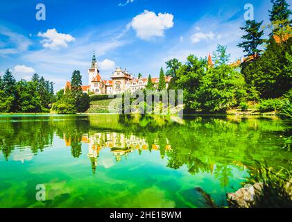 Travel destination- Pruhonice town palace with reflection in a green water lake. Sightseeing in Czech republics Stock Photo