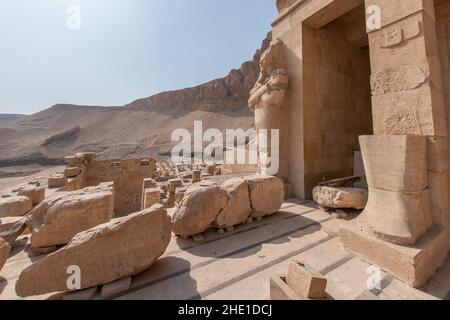 Stone statues of Osiris at Hatshepsut's mortuary temple, one of the most famous archeological sites in Egypt. Stock Photo