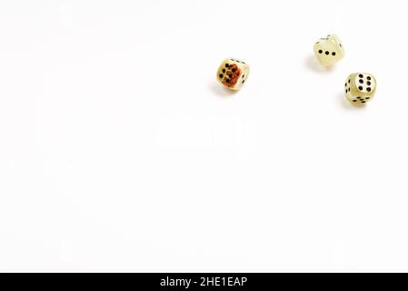 Dices made of natural stone on a white background. Copy space. Gaming. Stock Photo